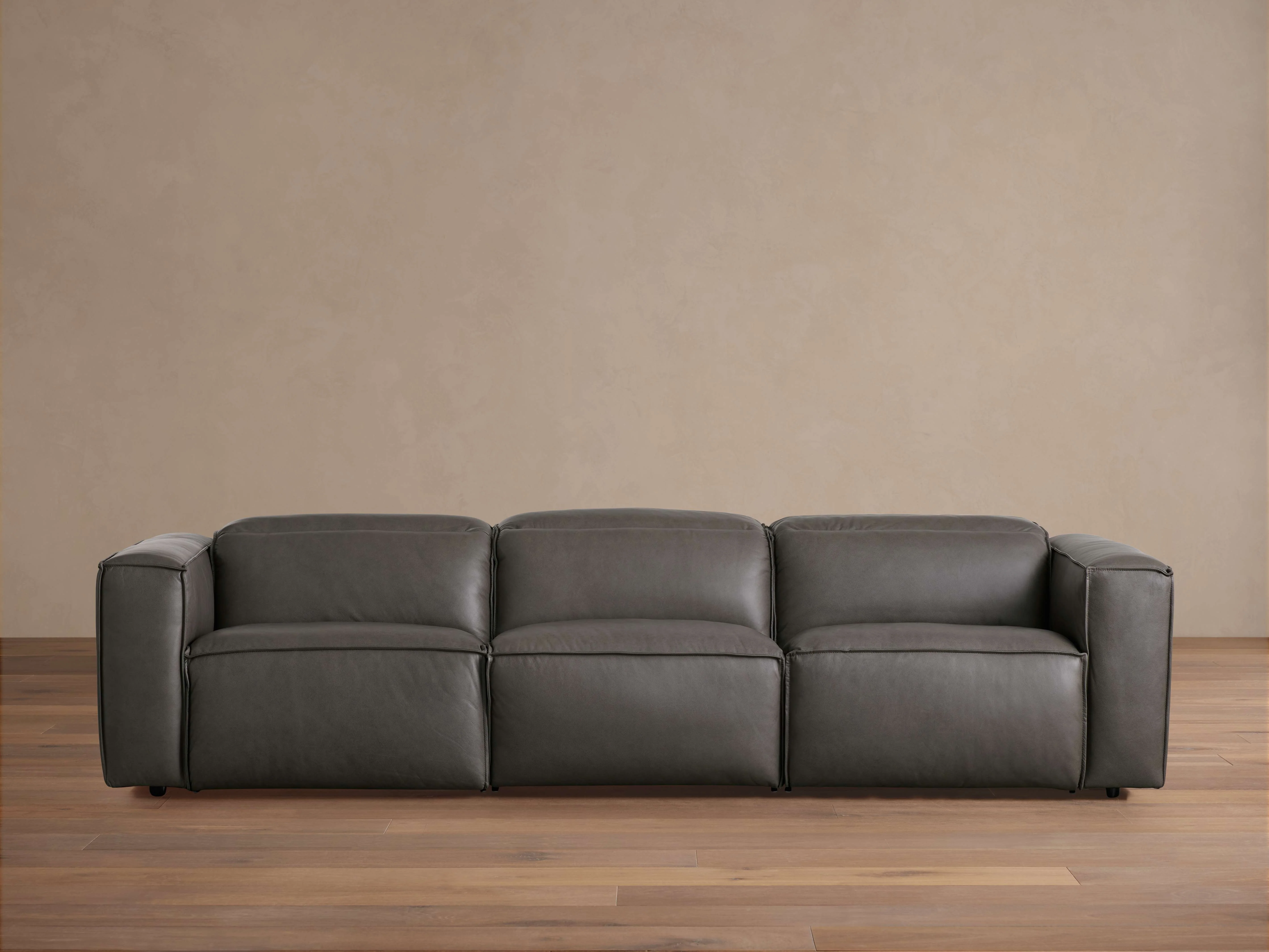 10065-coburn-leather-three-piece-motion-sofa-1.webp