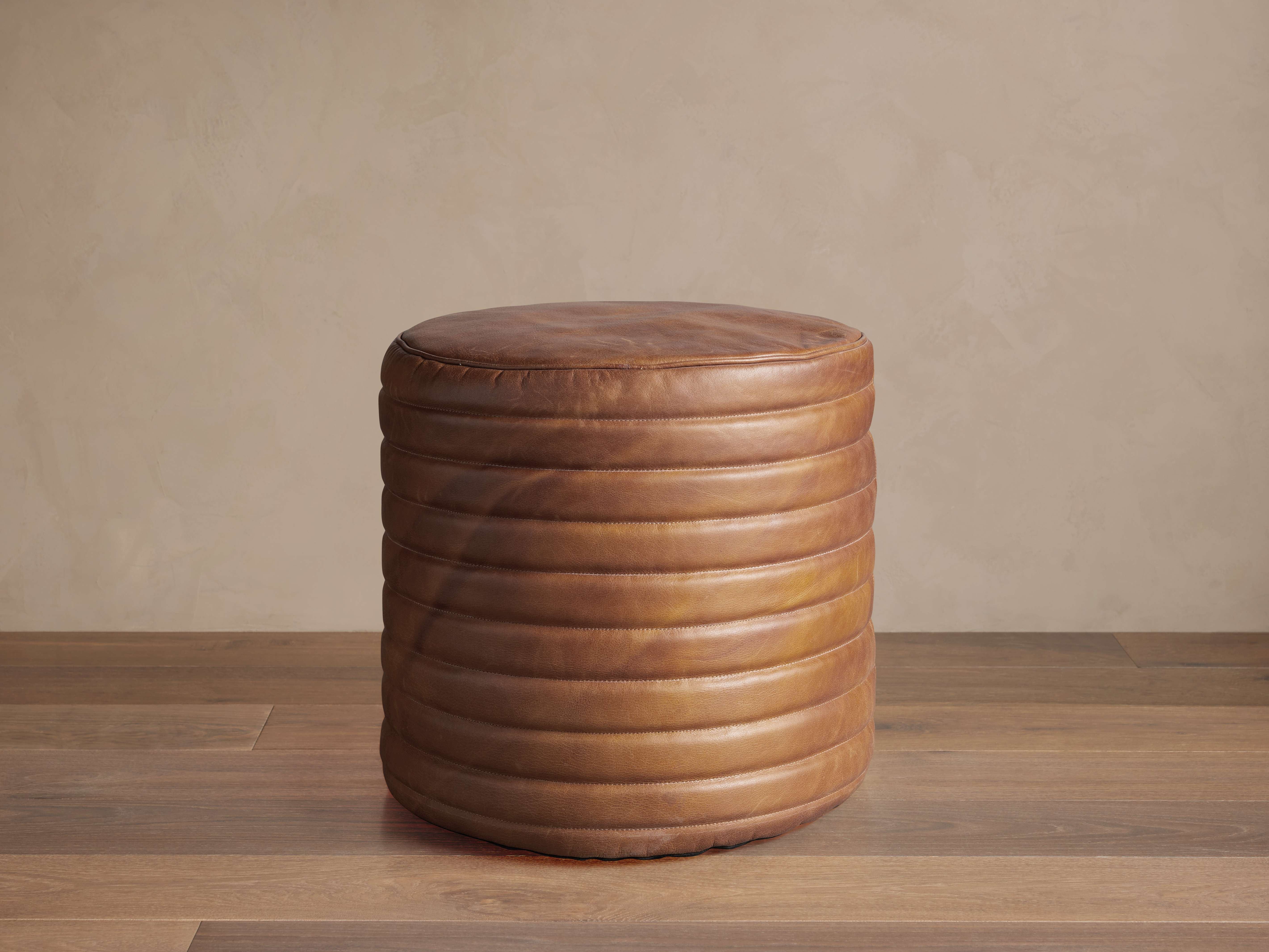 1646-round-channel-leather-pouf-1.jpg
